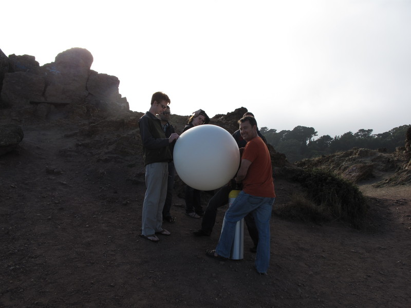 Inflating the balloon at Corona Heights Park. The sun was starting to come down and the fog was starting to drift in.