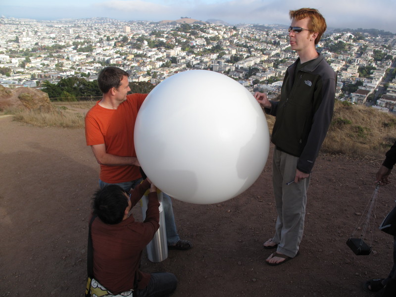 Mark tweaks the balloon's nipple.