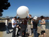 Careful gondola attachment. At this point, the primary knot holding the cord to the balloon came undone. Whoops! Good thing we hadn't let go yet!