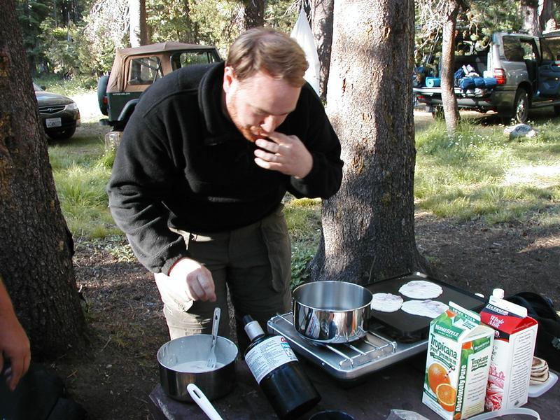 Cary cooking strawberry pancakes for breakfast