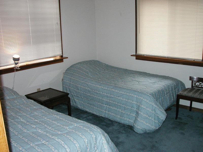 One small bedroom with two twin beds is downstairs