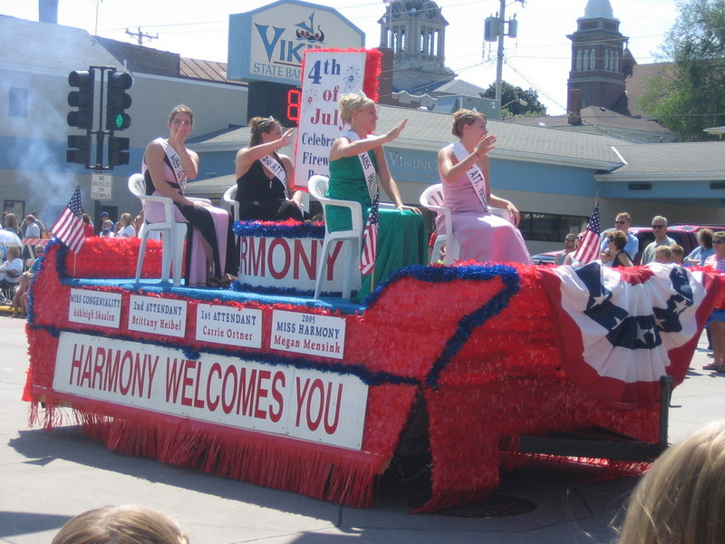 I guess Harmony is a nearby Iowa town, which has beauty pageants