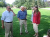 Joe, Perry, and Holly chat before a group photo